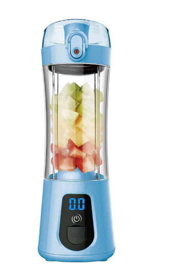 Blue portable blender with digital display, filled with assorted fruit cubes.