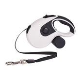 Retractable dog leash with waste bag holder, black and white plastic design