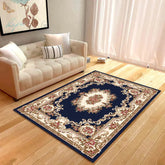 Elegant living room with cream sofa and ornate floral navy area rug on wood floor