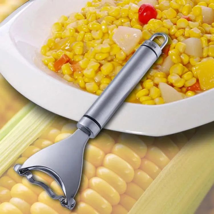 Stainless steel corn peeler with corn salad in a white plate background