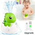 Green dinosaur bath toy spraying water, baby playing in tub, USB charging cable included