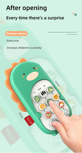 Child pressing buttons on green dinosaur toy phone for kids, educational toy product.