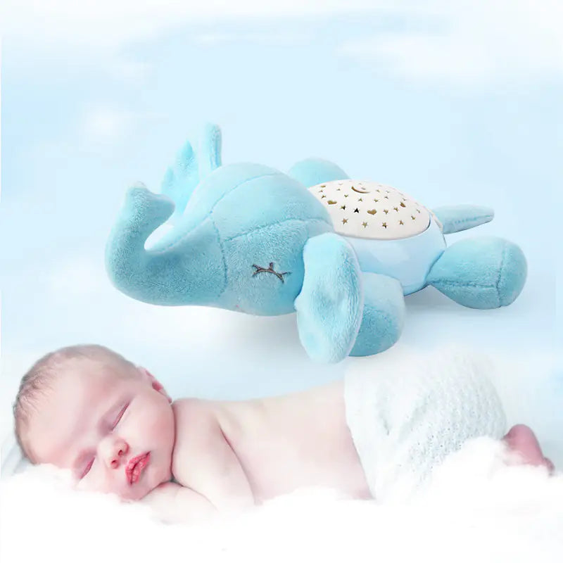 Sleeping baby with blue elephant plush night light toy on soft cloud background