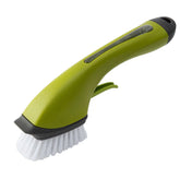 Green dish brush with ergonomic handle and white bristles for kitchen cleaning