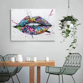 Colorful graffiti lips wall art in modern dining room with hanging plant and minimalist decor.
