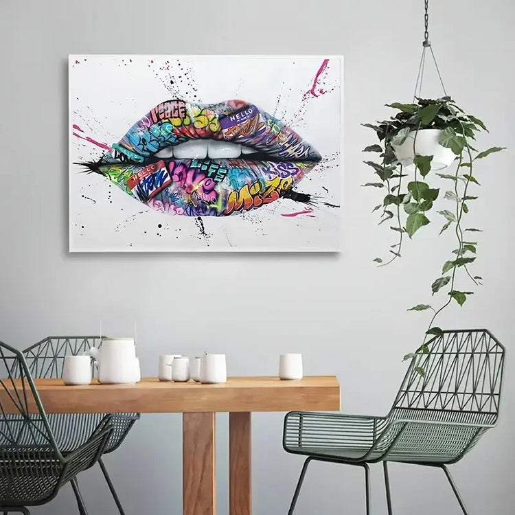 Colorful graffiti lips wall art in modern dining room with hanging plant and minimalist decor.