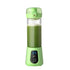 Green portable blender with digital display filled with green smoothie