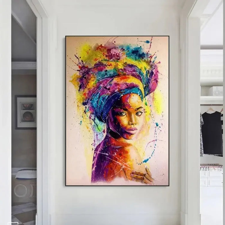 Colorful abstract portrait of a woman with headwrap art hanging in a modern hallway