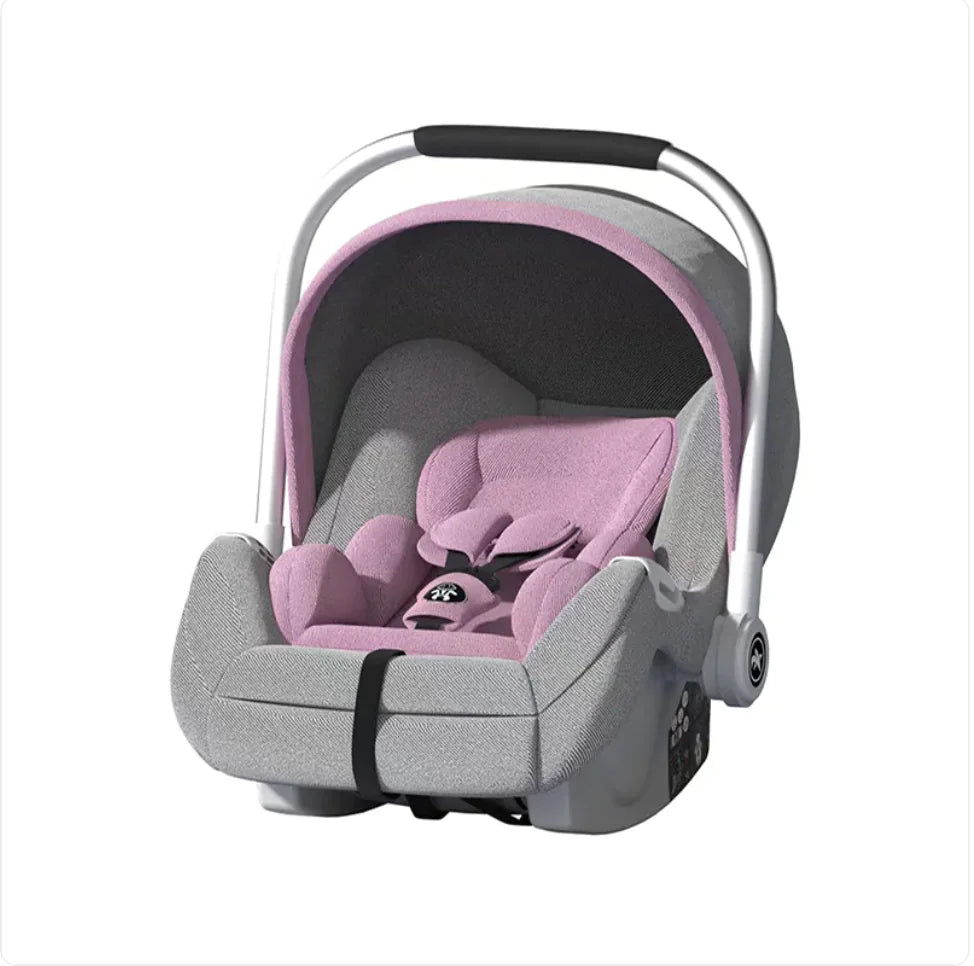 Pink and grey infant car seat with safety harness and carry handle