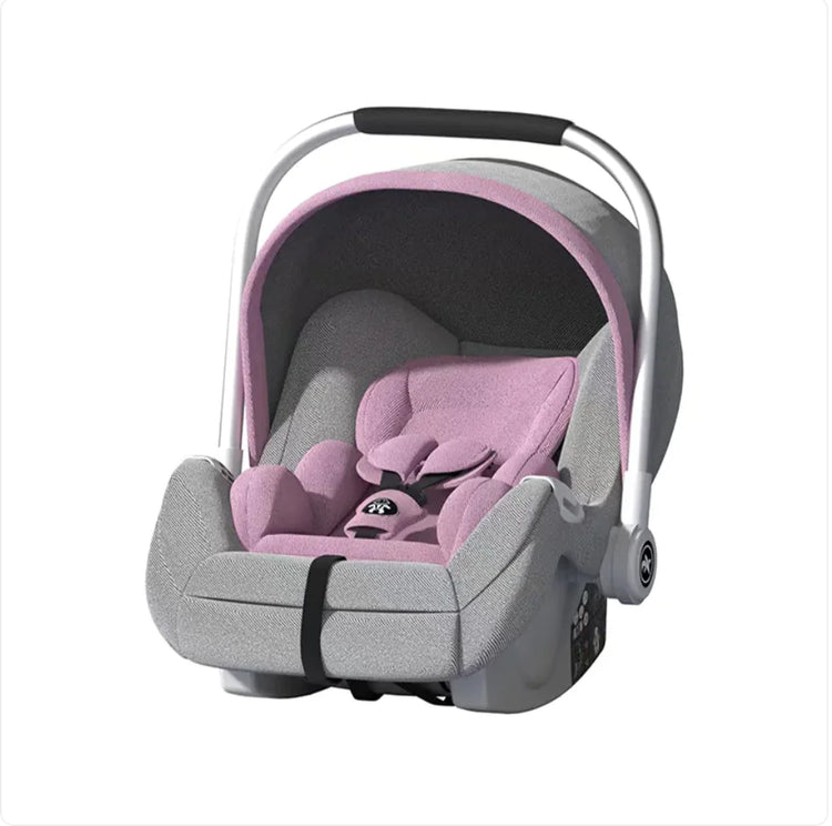 Pink and grey infant car seat with safety harness and carry handle