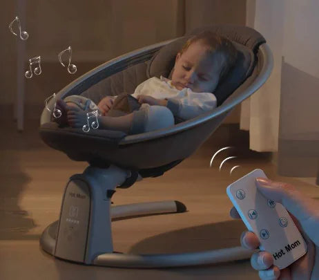 Baby sleeping in Hot Mom automatic rocking chair with remote control and music notes