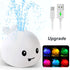 Cute whale-shaped night light with water spray, USB charging, and colorful LED modes.