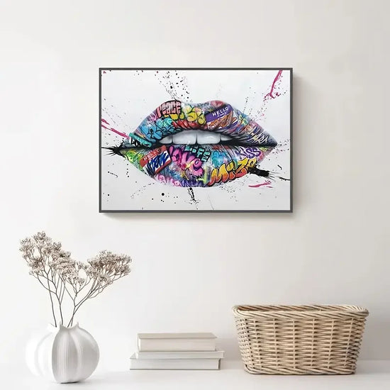 Colorful graffiti lips wall art above white console with vase and wicker basket