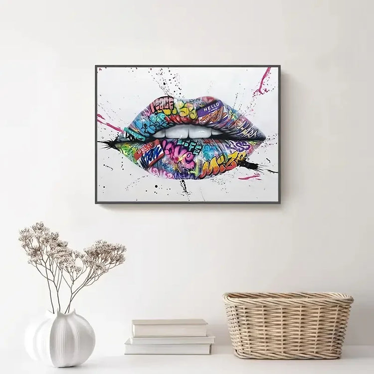 Colorful graffiti lips wall art above white console with vase and wicker basket