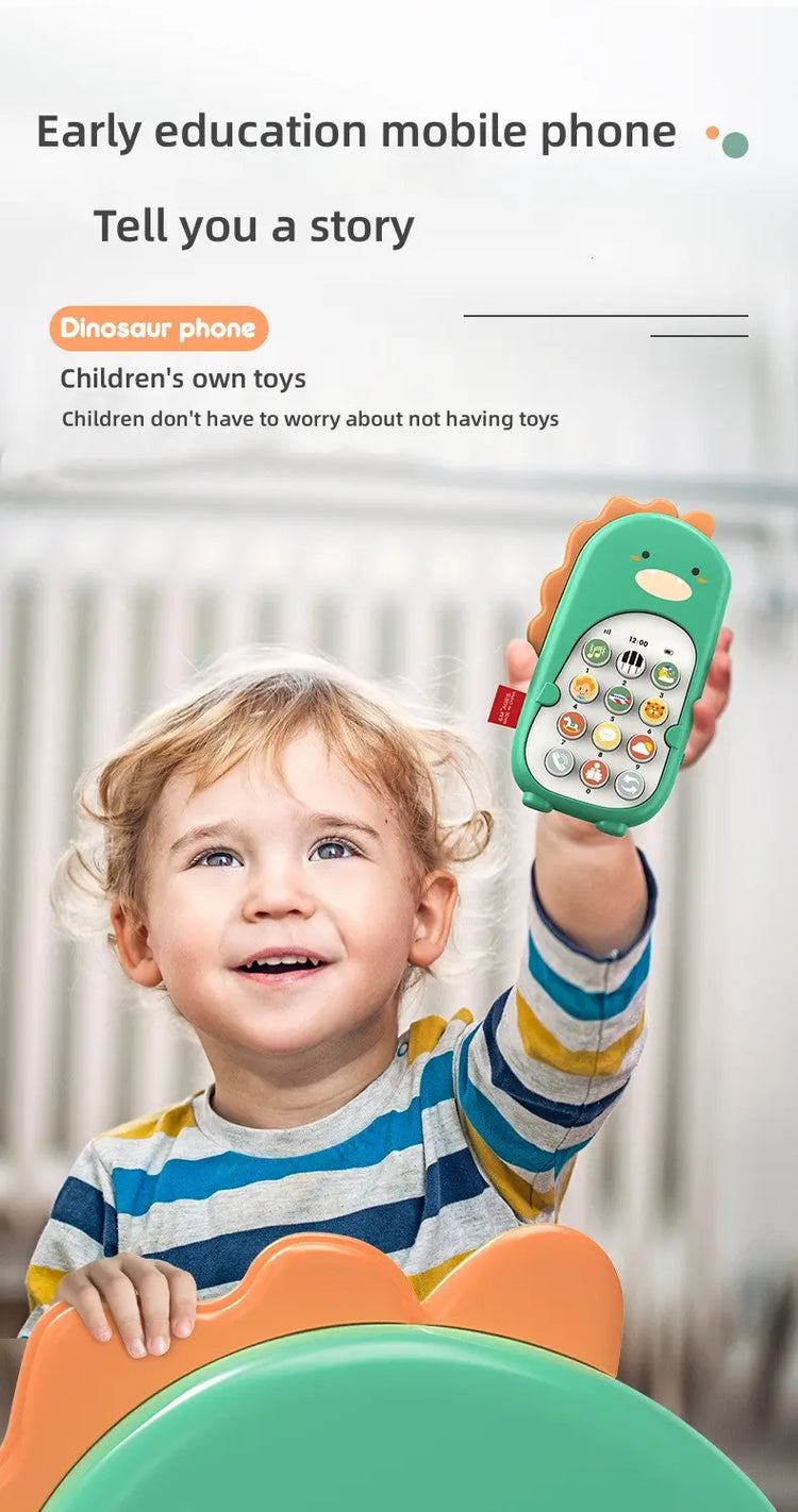 Smiling child holding up a green dinosaur-shaped early education toy mobile phone