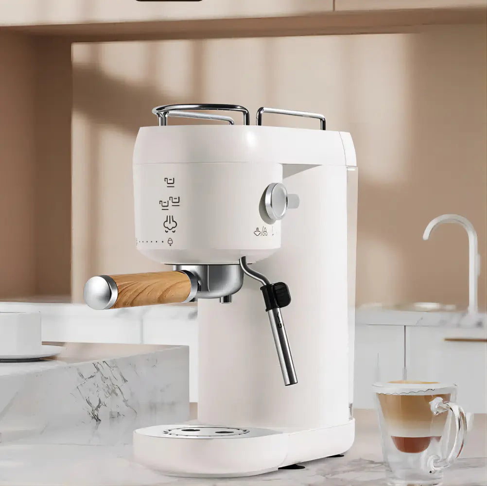 Modern white espresso machine with wood accents on marble kitchen counter, latte nearby